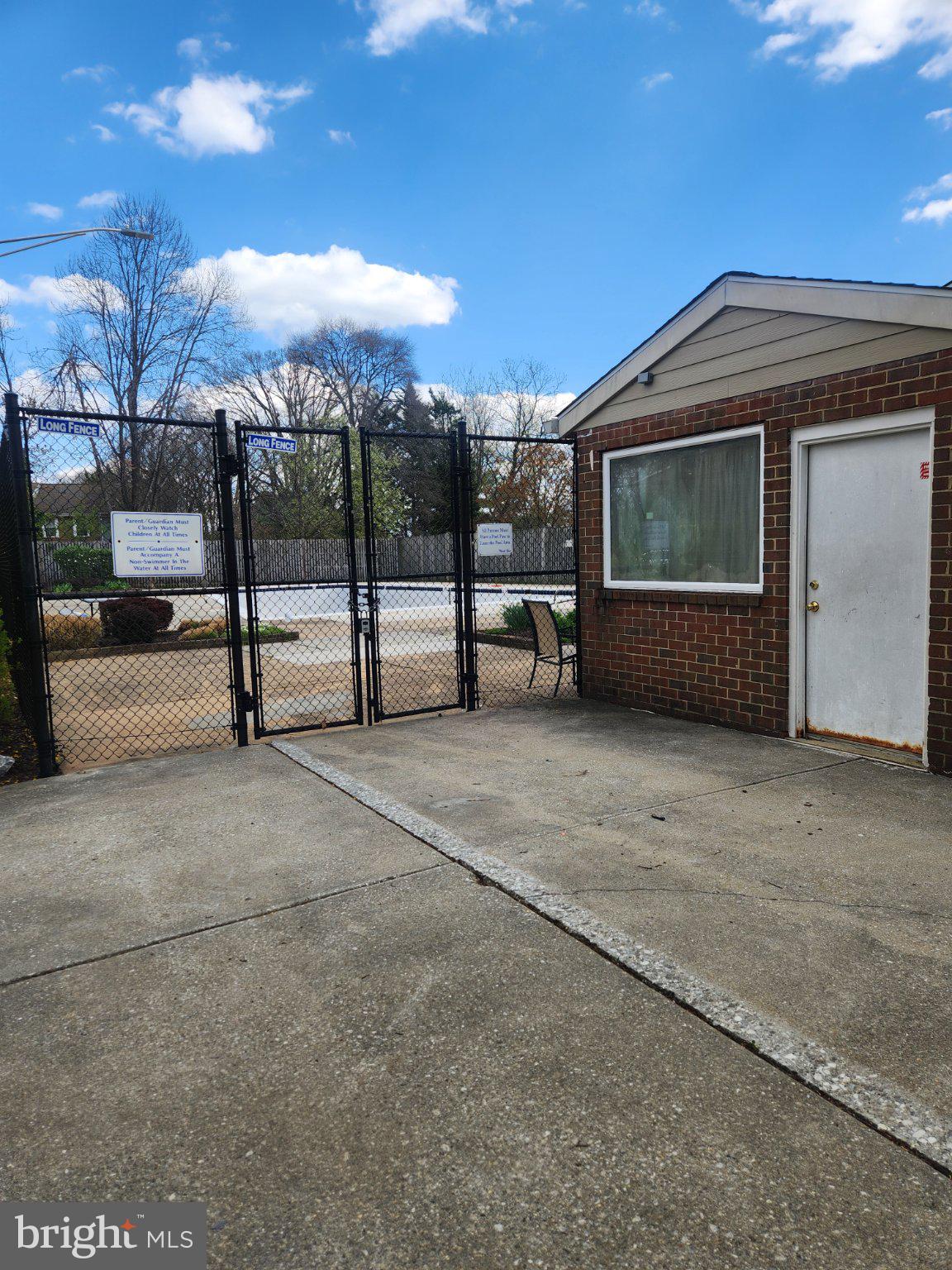 207 Erin Way, Unit T4 Reisterstown, MD 21136 - Photo 25 of 28 Gated entrance to community pool.