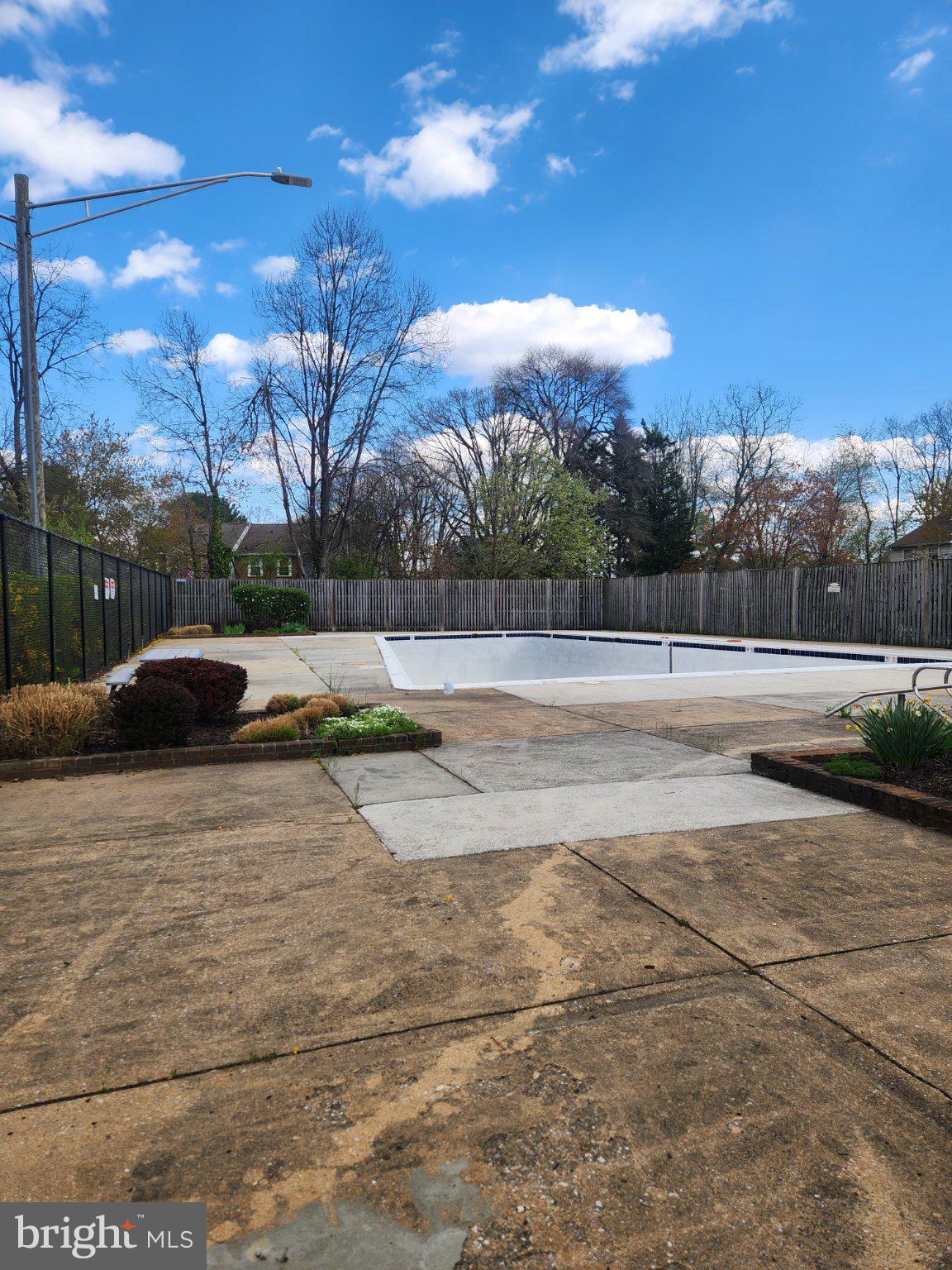 207 Erin Way, Unit T4 Reisterstown, MD 21136 - Photo 26 of 28 Serene poolside retreat awaits summer.