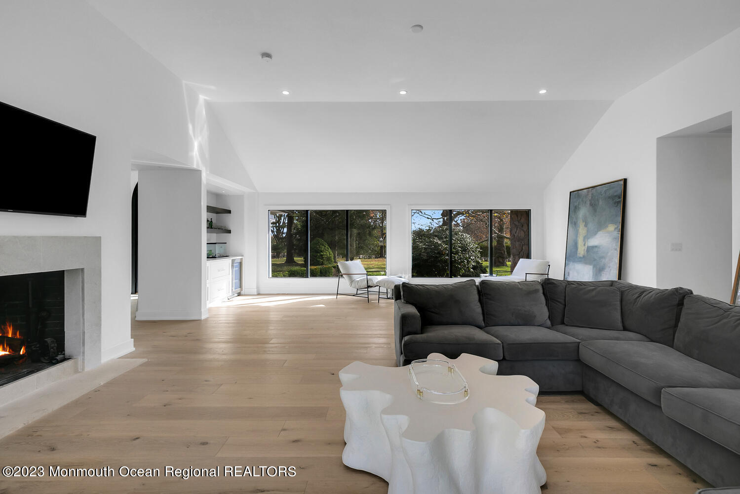 166 Rumson Road Rumson, NJ 07760 - Photo 11 of 46 a living room with furniture a fireplace and a flat screen tv