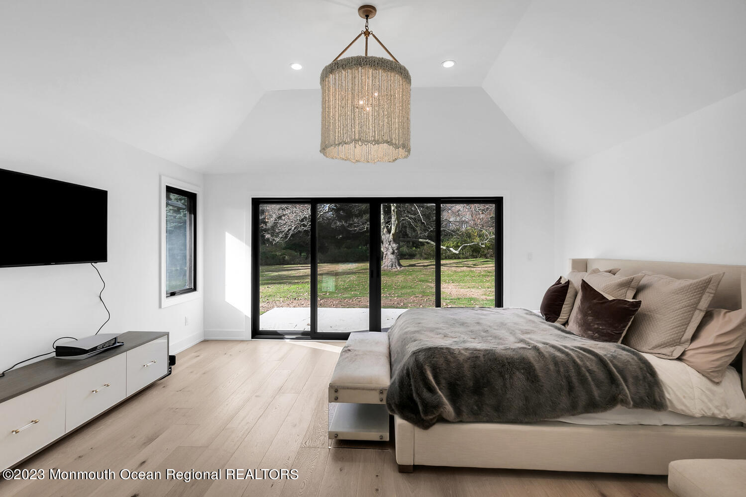 166 Rumson Road Rumson, NJ 07760 - Photo 16 of 46 a bedroom with a large bed and a flat tv screen