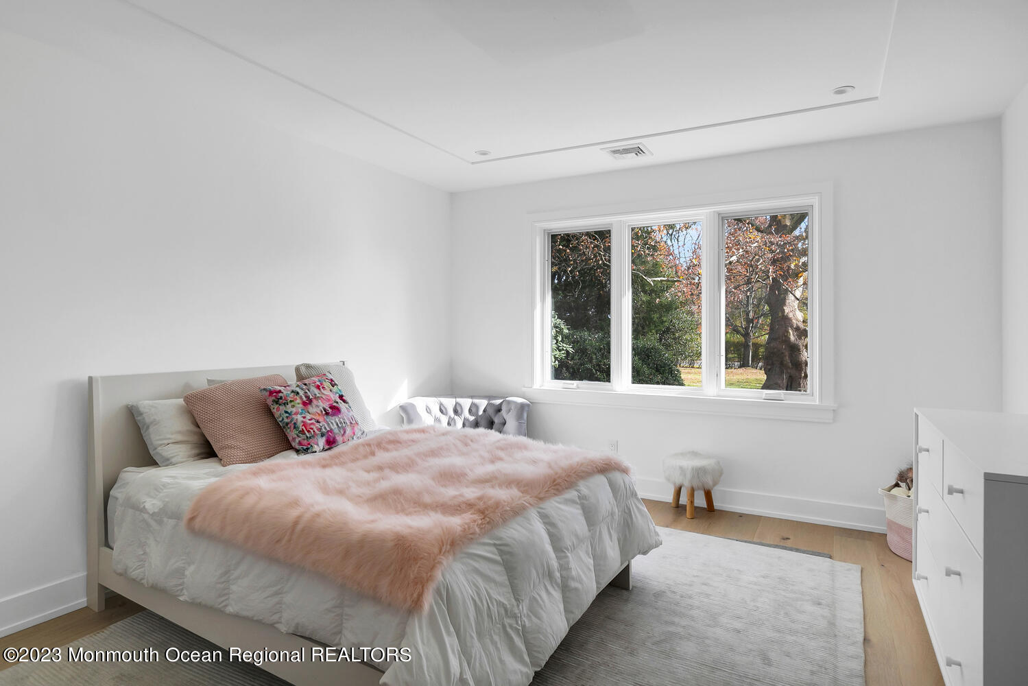 166 Rumson Road Rumson, NJ 07760 - Photo 22 of 46 a bedroom with a large bed and a large window