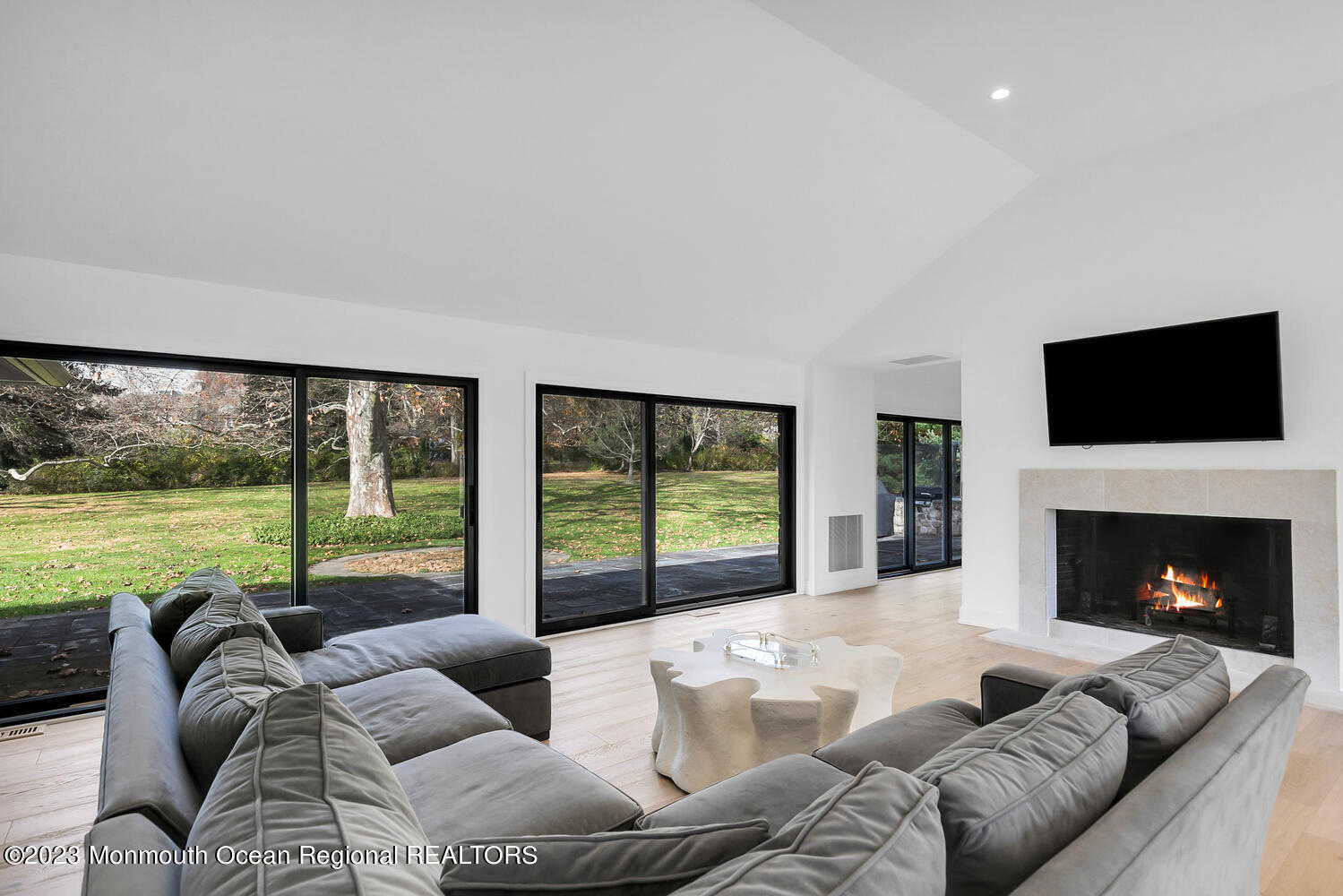 166 Rumson Road Rumson, NJ 07760 - Photo 10 of 46 a living room with furniture large window and a fireplace