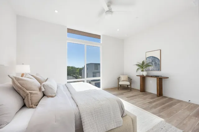 a bedroom with a bed and lamp