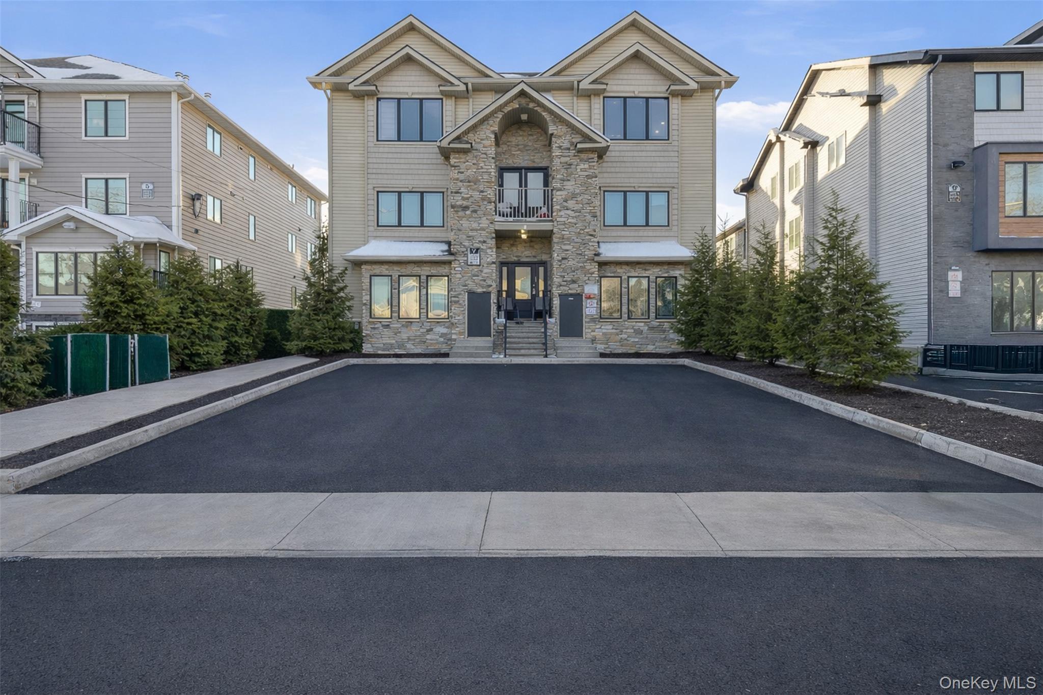 7 Park Street, Unit 301 Spring Valley, NY 10977 - Photo 1 of 33 a front view of a residential houses