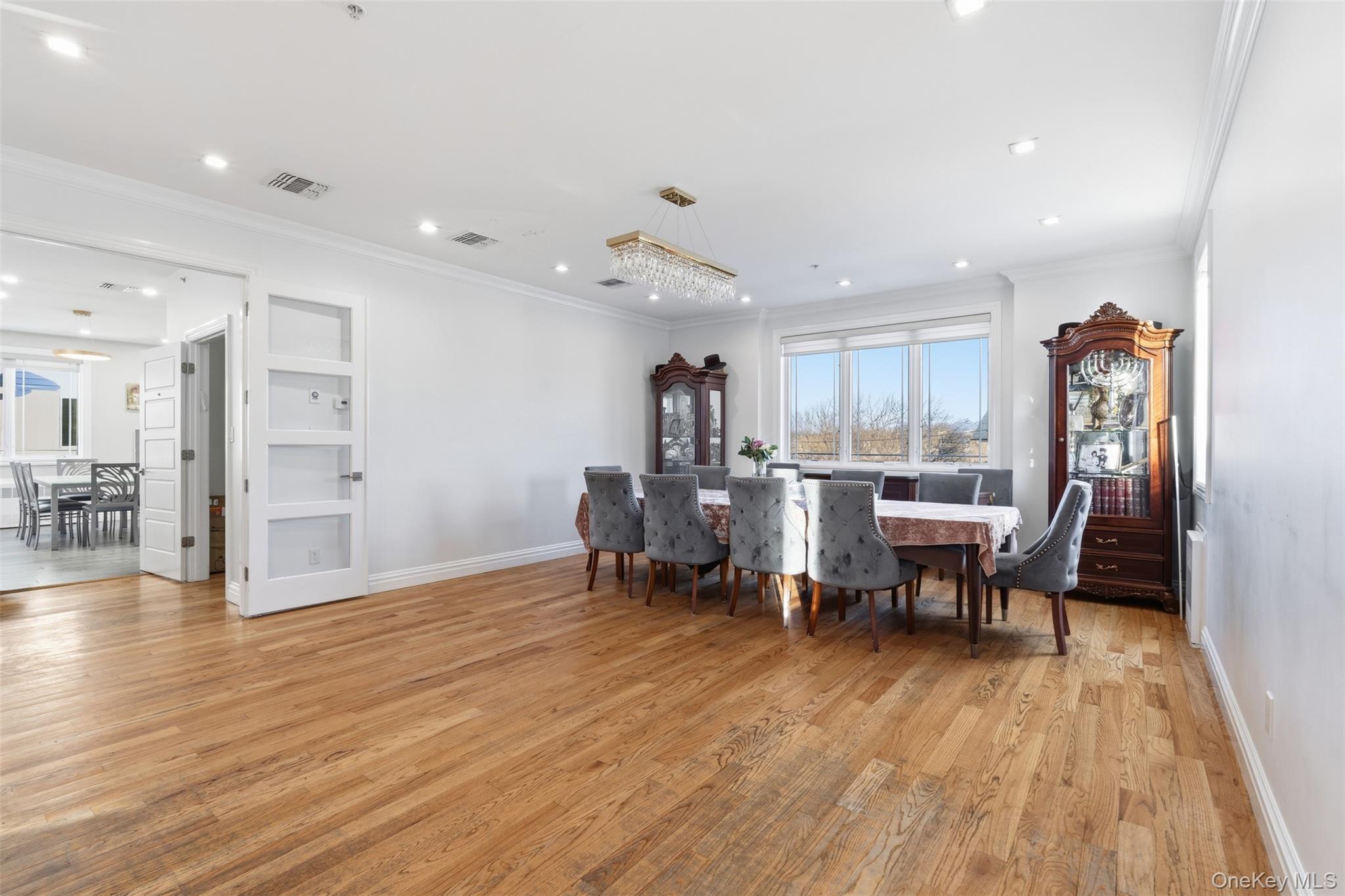 7 Park Street, Unit 301 Spring Valley, NY 10977 - Photo 13 of 33 a view of a dining room with furniture and wooden floor