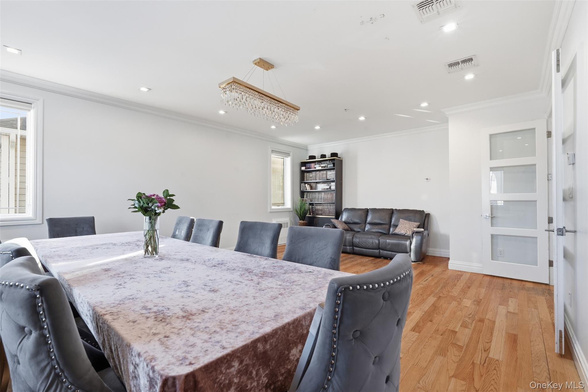 7 Park Street, Unit 301 Spring Valley, NY 10977 - Photo 16 of 33 a living room with furniture and a wooden floor