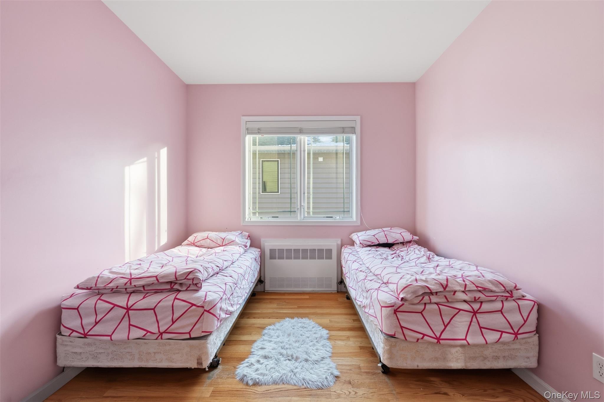 7 Park Street, Unit 301 Spring Valley, NY 10977 - Photo 19 of 33 a bedroom with a bed and window