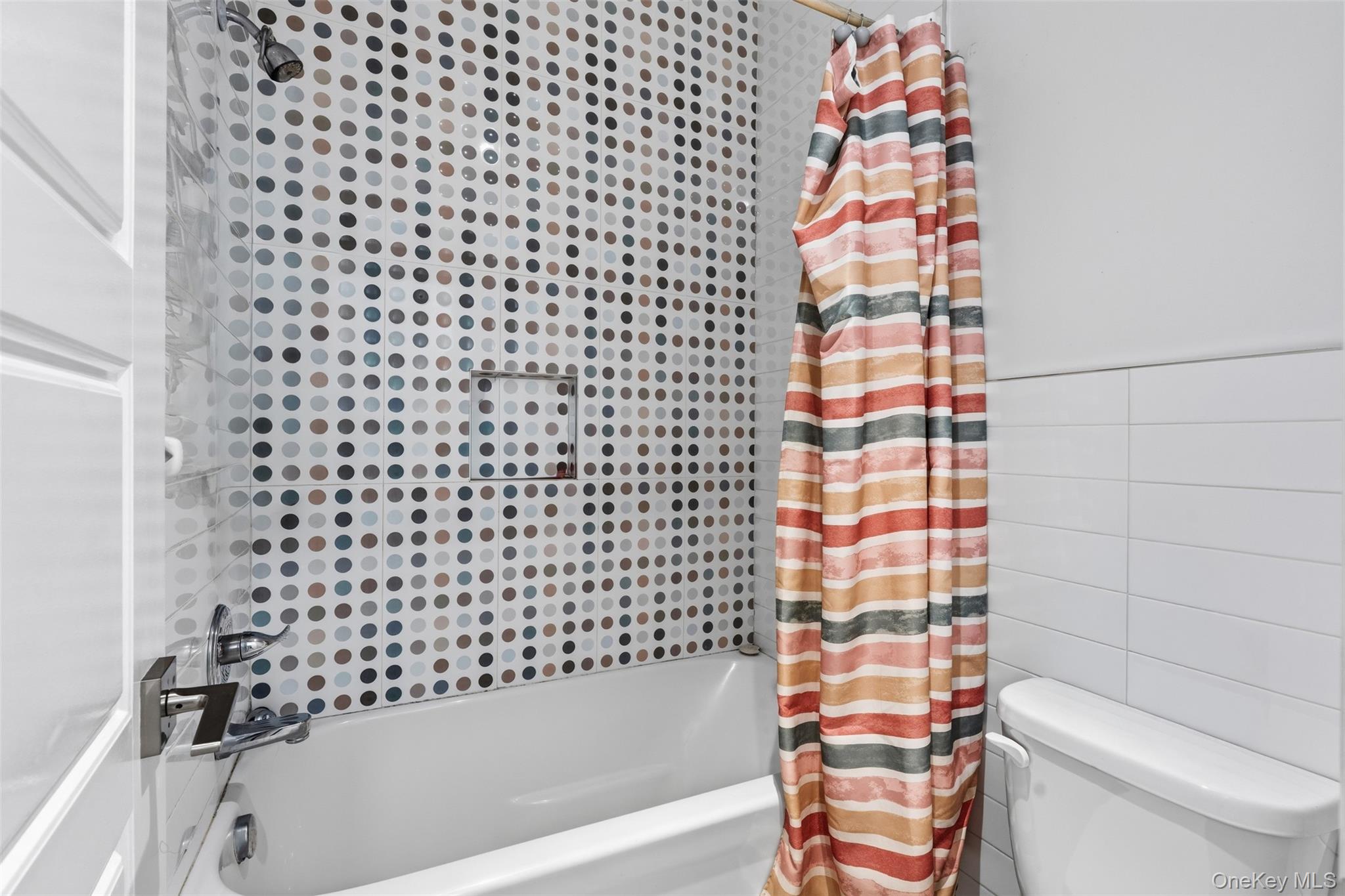 7 Park Street, Unit 301 Spring Valley, NY 10977 - Photo 22 of 33 a bathroom with a bathtub and a toilet