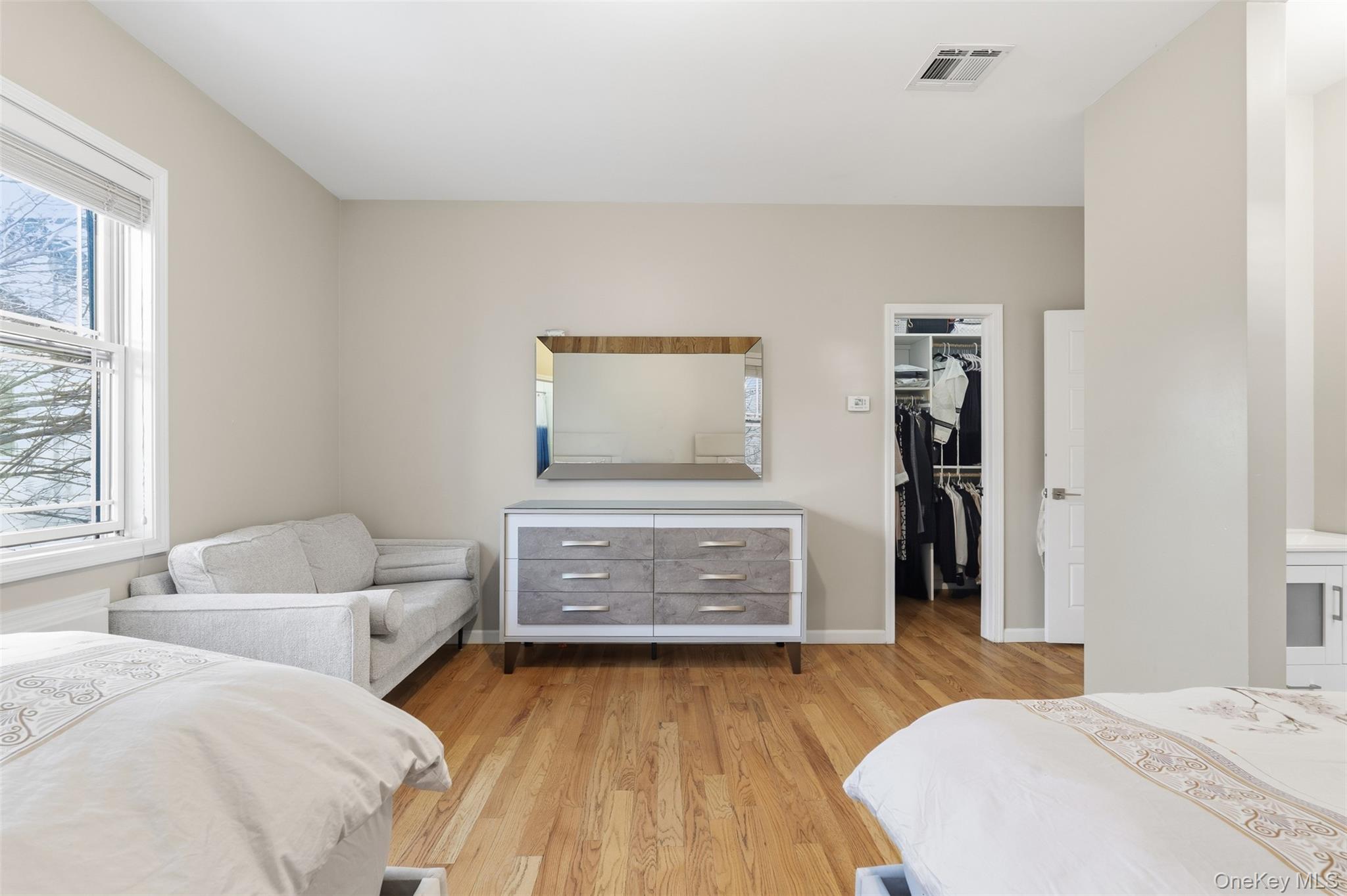 7 Park Street, Unit 301 Spring Valley, NY 10977 - Photo 26 of 33 a bedroom with a bed and a dresser