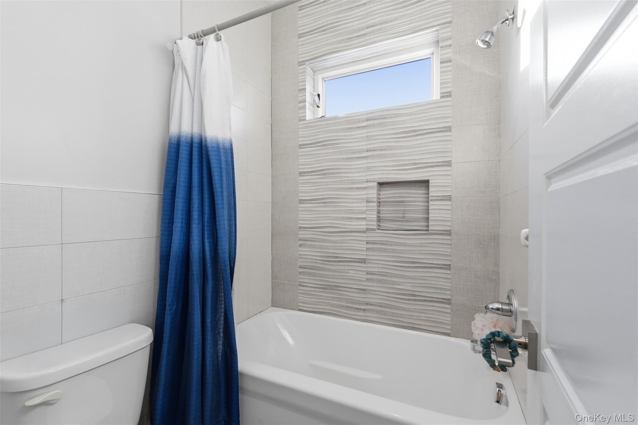 7 Park Street, Unit 301 Spring Valley, NY 10977 - Photo 27 of 33 a bathroom with a toilet and a bathtub