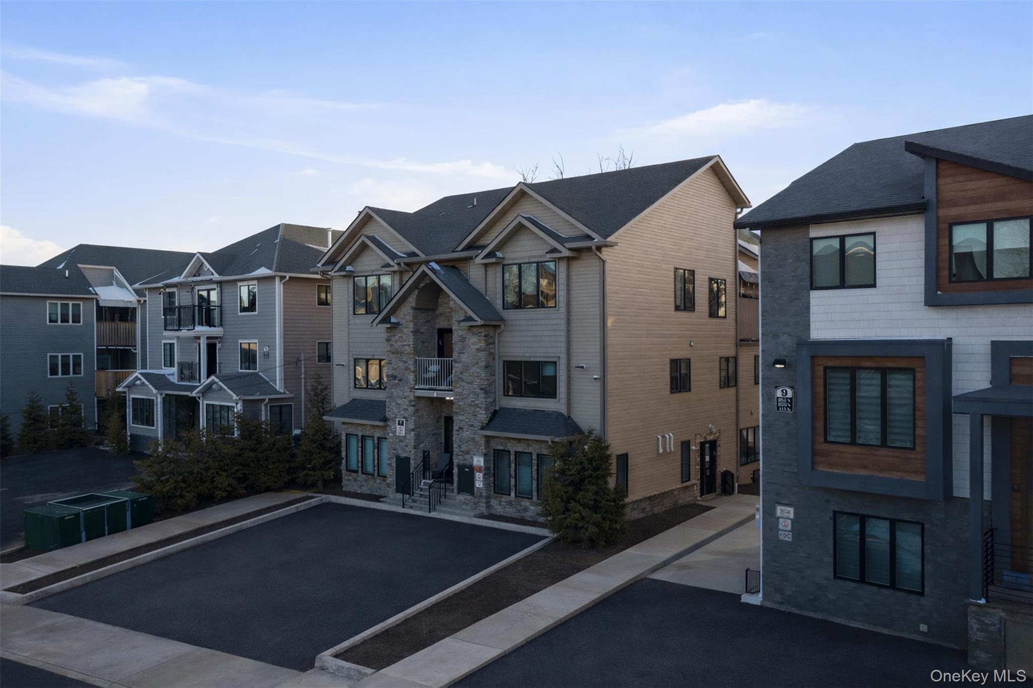 7 Park Street, Unit 301 Spring Valley, NY 10977 - Photo 3 of 33 front view of a house with a yard