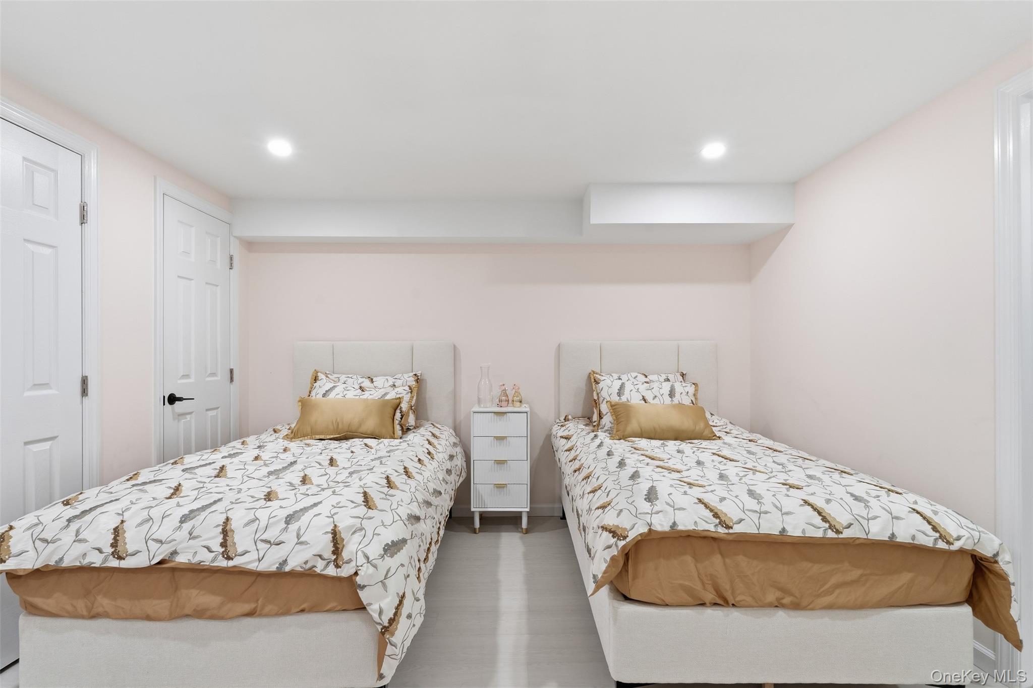 7 Park Street, Unit 301 Spring Valley, NY 10977 - Photo 31 of 33 a bedroom with two beds and painted walls