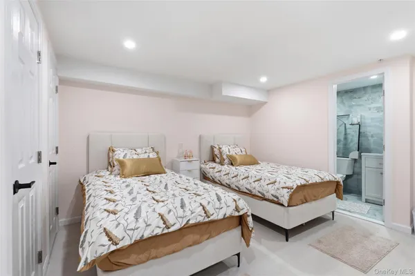 a bedroom with two beds and painted walls