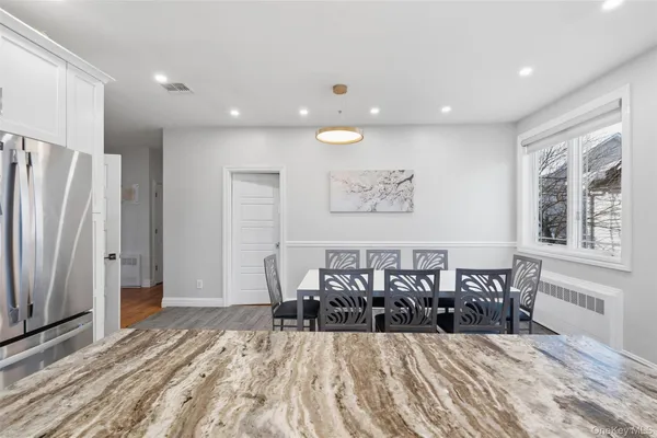 a bed room with a bed and a large window