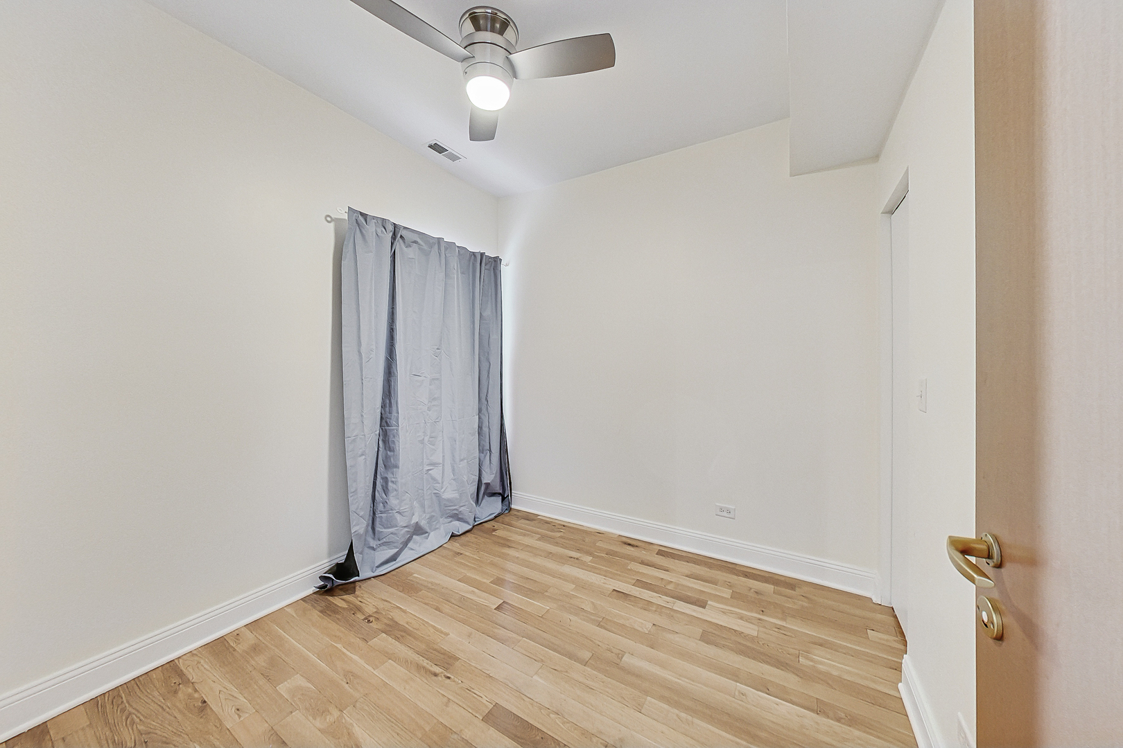 7321 North Paulina Street, Unit 2 Chicago, IL 60626 - Photo 15 of 27 an empty room with a empty space and a ceiling fan