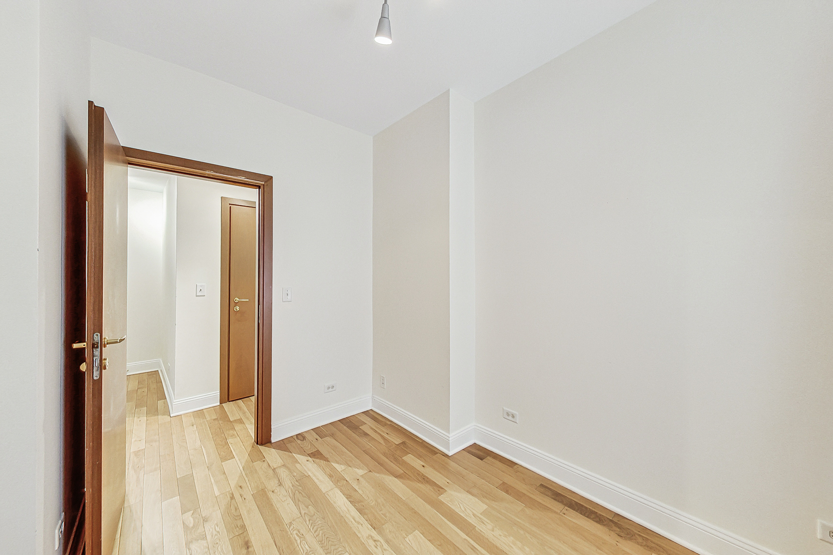 7321 North Paulina Street, Unit 2 Chicago, IL 60626 - Photo 20 of 27 a view of a room with wooden floor and a bathroom