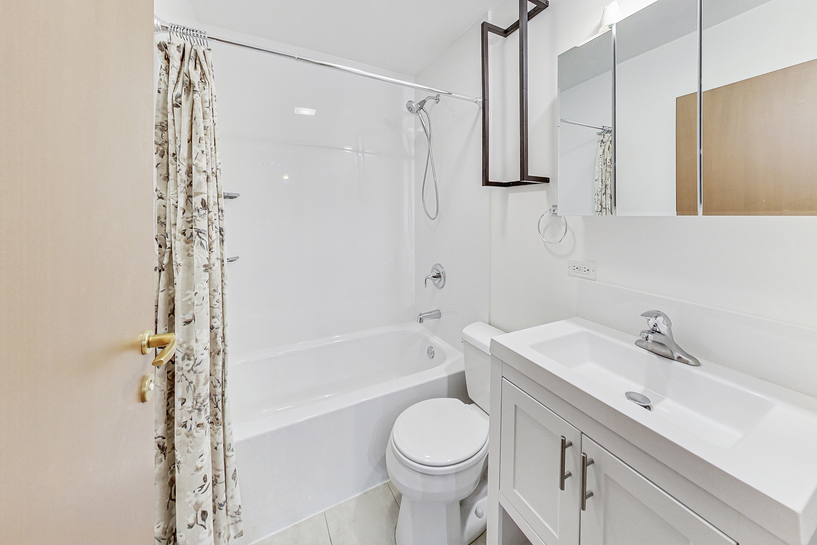 7321 North Paulina Street, Unit 2 Chicago, IL 60626 - Photo 21 of 27 a bathroom with a sink toilet and shower