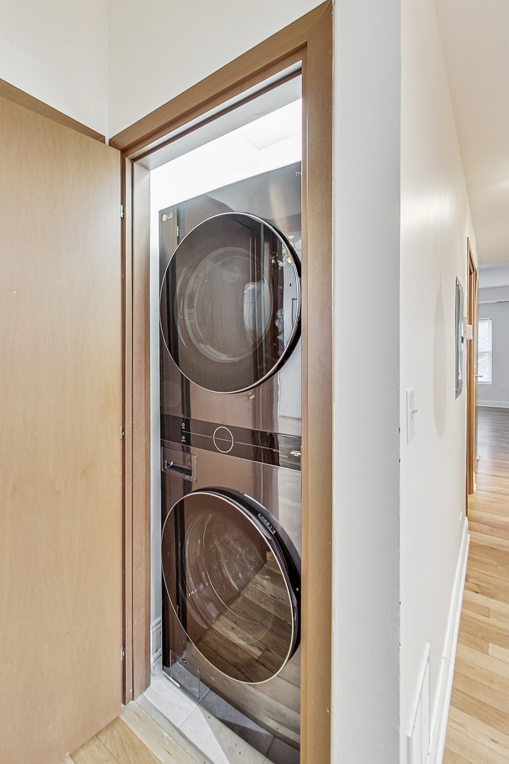7321 North Paulina Street, Unit 2 Chicago, IL 60626 - Photo 22 of 27 a view of a hallway with washer and dryer