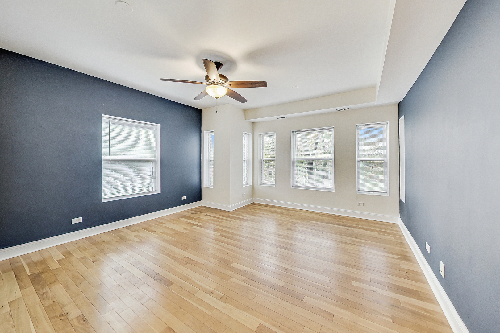 7321 North Paulina Street, Unit 2 Chicago, IL 60626 - Photo 4 of 27 a view of an empty room with window and wooden floor