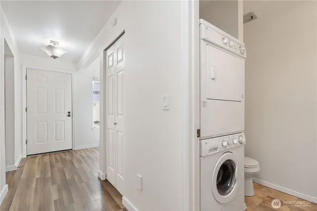a view of a hallway with washer and dryer