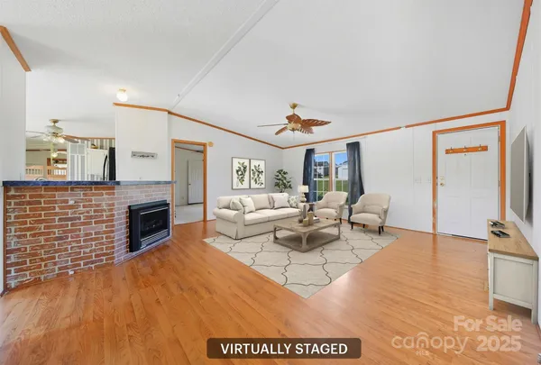 a living room with fireplace furniture and a flat screen tv