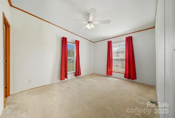 a view of a room with a projector and a fan
