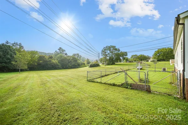 a view of a swimming pool with an outdoor space and seating area