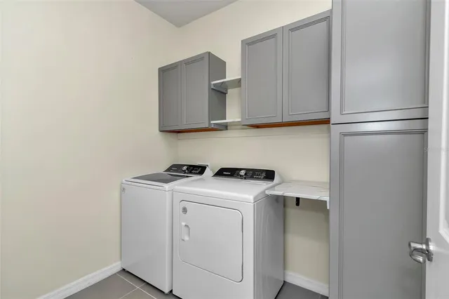 a front view of a house with yard and green space