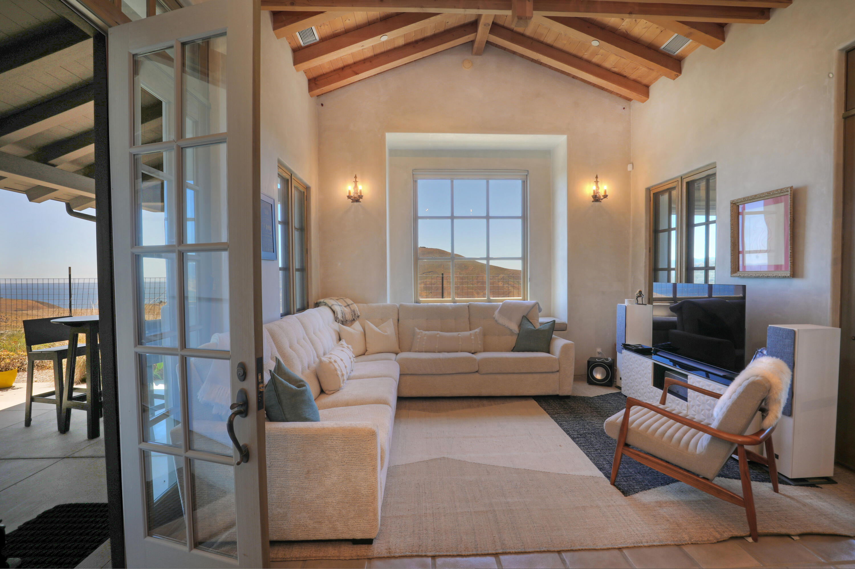 117 Hollister Ranch Road Goleta, CA 93117 - Photo 3 of 3 a living room with furniture and a fireplace