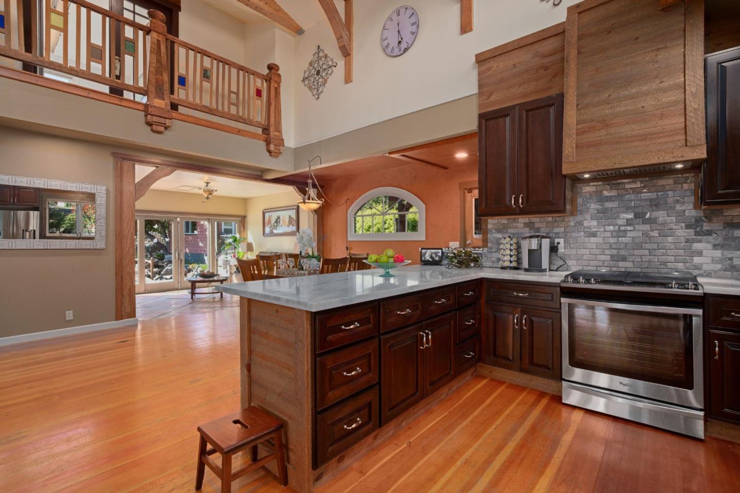 1200 Amesti Road Watsonville, CA 95076 - Photo 8 of 47 a kitchen with stainless steel appliances granite countertop a stove a sink dishwasher and microwave with wooden floor