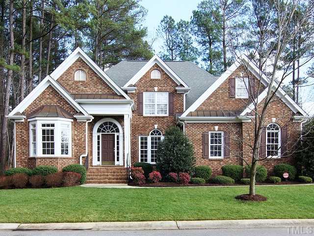 8604 Wapello Lane Raleigh, NC 27613 - Photo 1 of 25 8604 Wapello Lane: The immaculate landscaping reflects a tidy, classic brick facade with keystone accents over double-hung insulated windows.