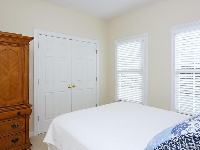 8604 Wapello Lane Raleigh, NC 27613 - Photo 18 of 25 Also on the main level is a second bedroom, conveniently located next to the full guest bath.