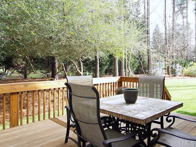 8604 Wapello Lane Raleigh, NC 27613 - Photo 23 of 25 Deck off morning room and master bedroom overlooks green backyard.