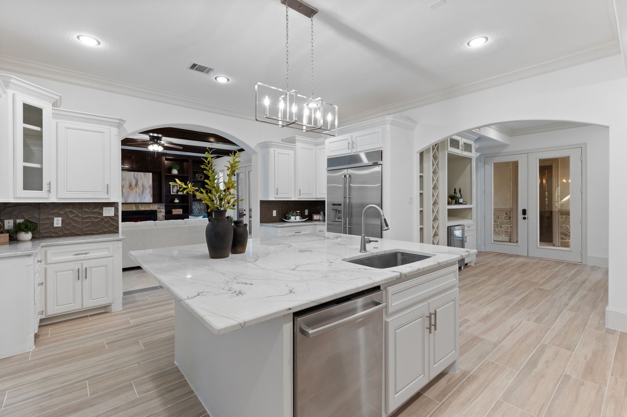 27502 Whispering Maple Way Spring, TX 77386 - Photo 14 of 46 a kitchen with sink and refrigerator