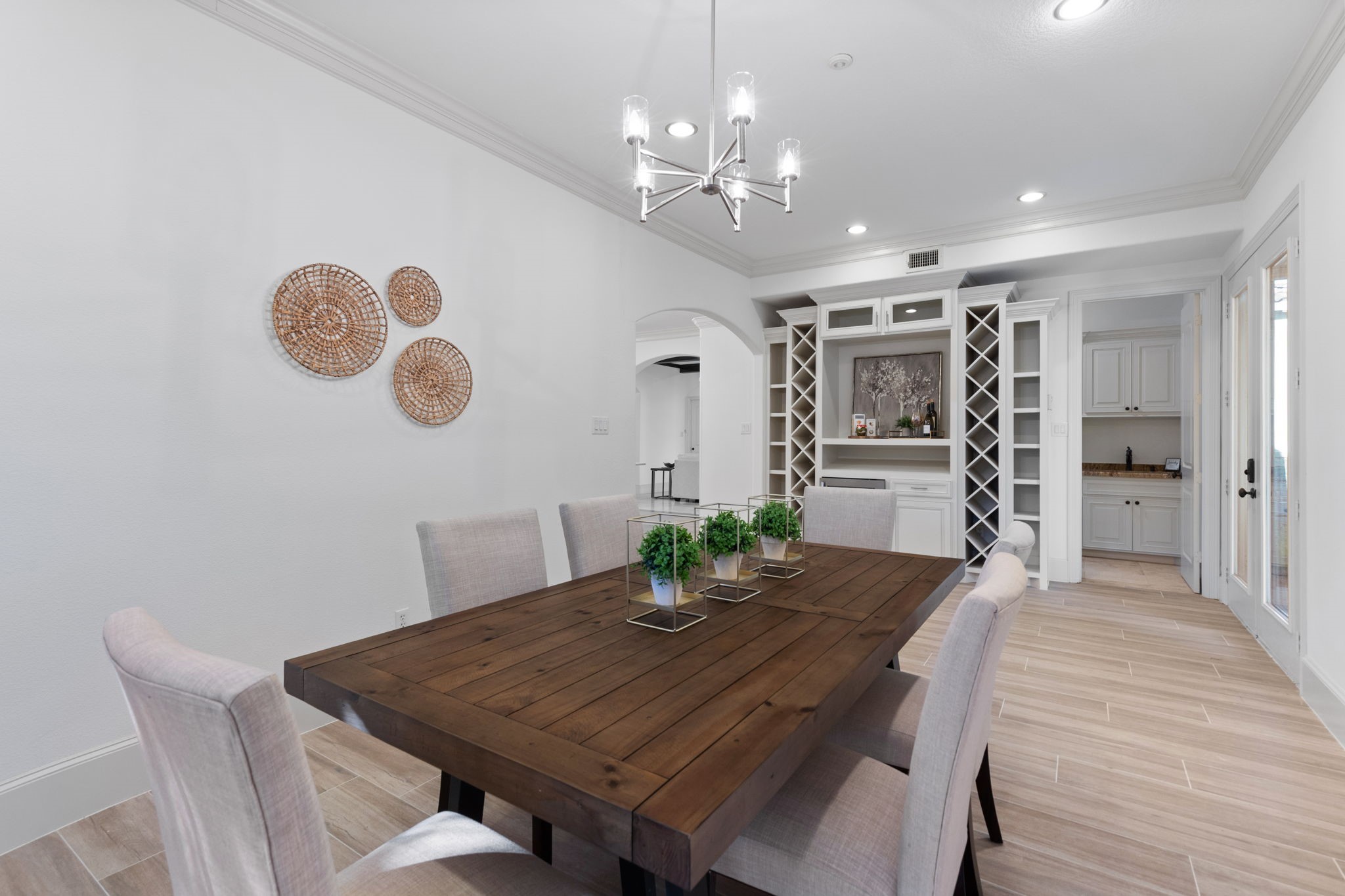 27502 Whispering Maple Way Spring, TX 77386 - Photo 17 of 46 a view of a dining room with furniture and wooden floor
