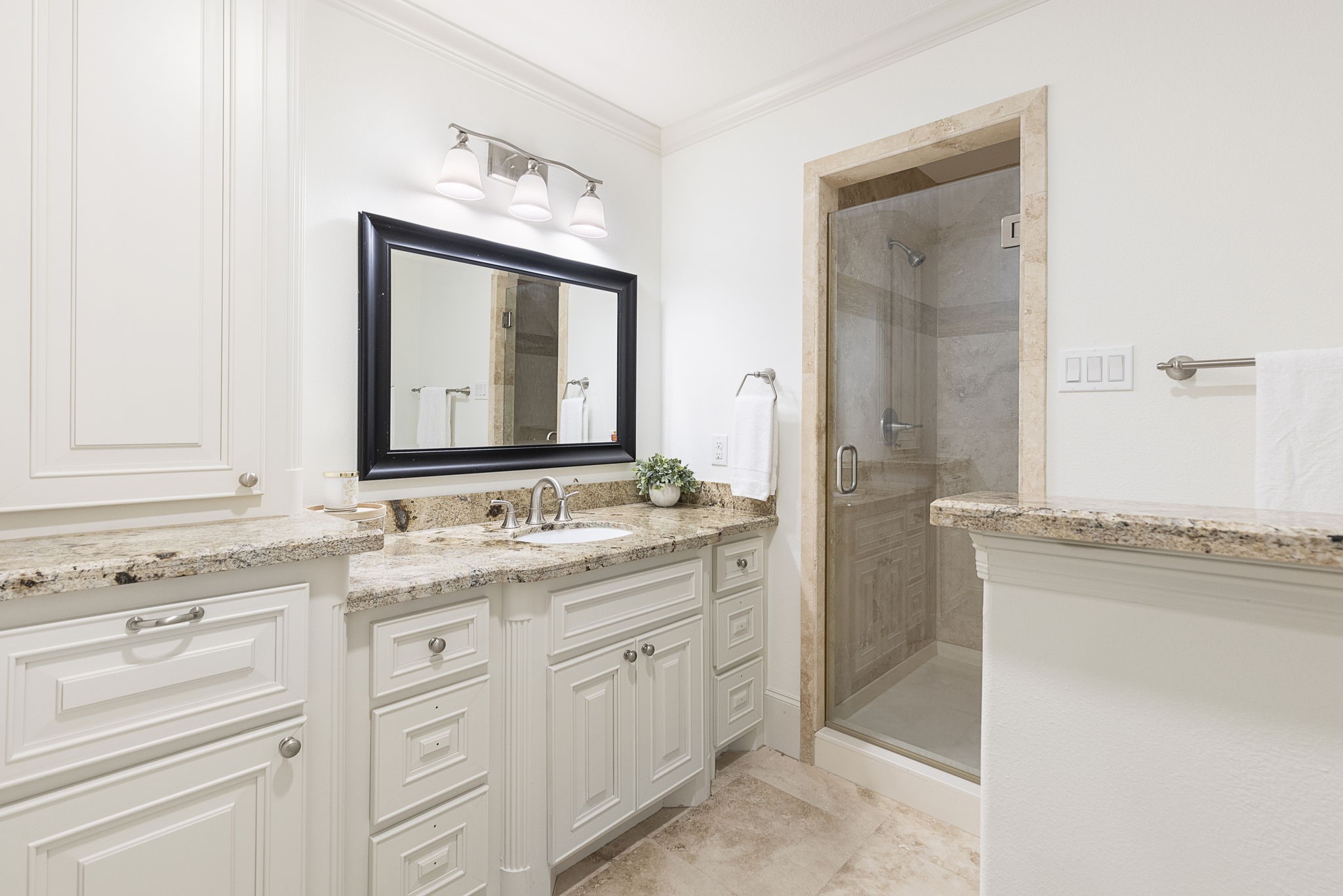 27502 Whispering Maple Way Spring, TX 77386 - Photo 34 of 46 En-suite Bath featuring a spacious vanity with granite counters, generous storage, stand-alone shower, and crown molding.