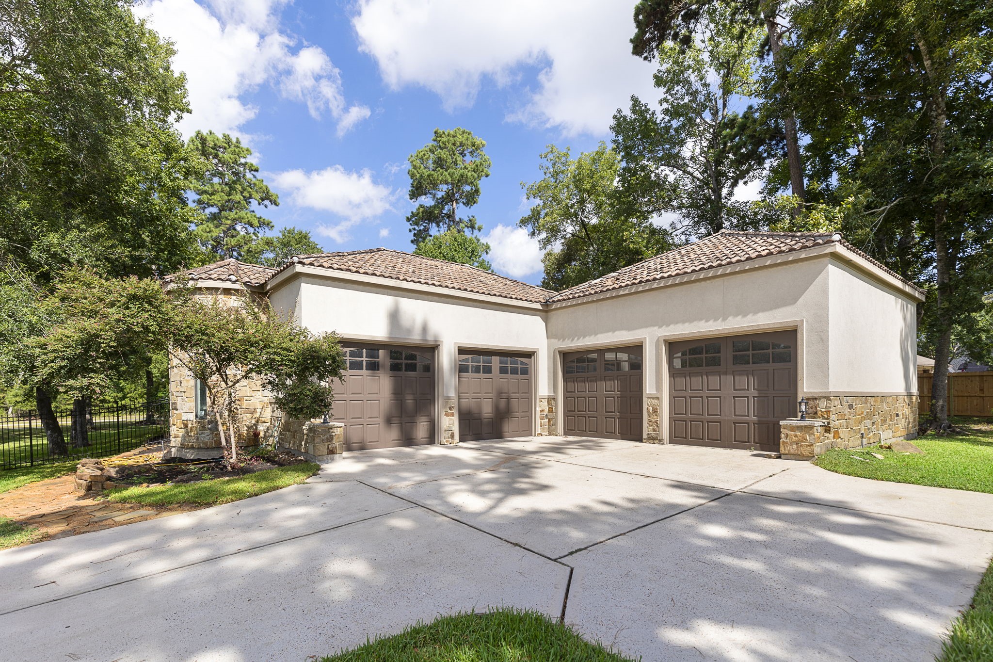 27502 Whispering Maple Way Spring, TX 77386 - Photo 39 of 46 a front view of a house with a yard and potted plants