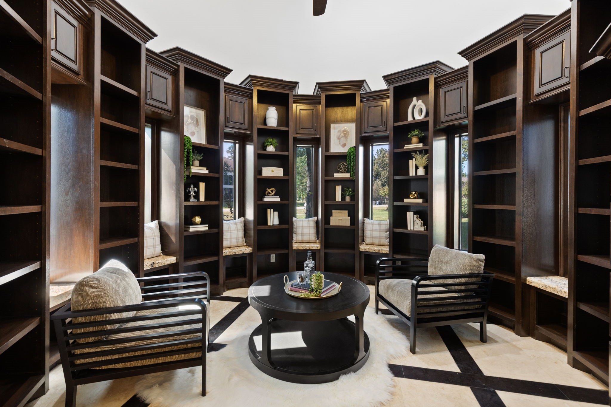 27502 Whispering Maple Way Spring, TX 77386 - Photo 6 of 46 Executive Study/Lounge with tile floors accented by wood inlay, custom built-ins framing each window, a built-in desk with granite counter, and an elevated ceiling with crown molding!