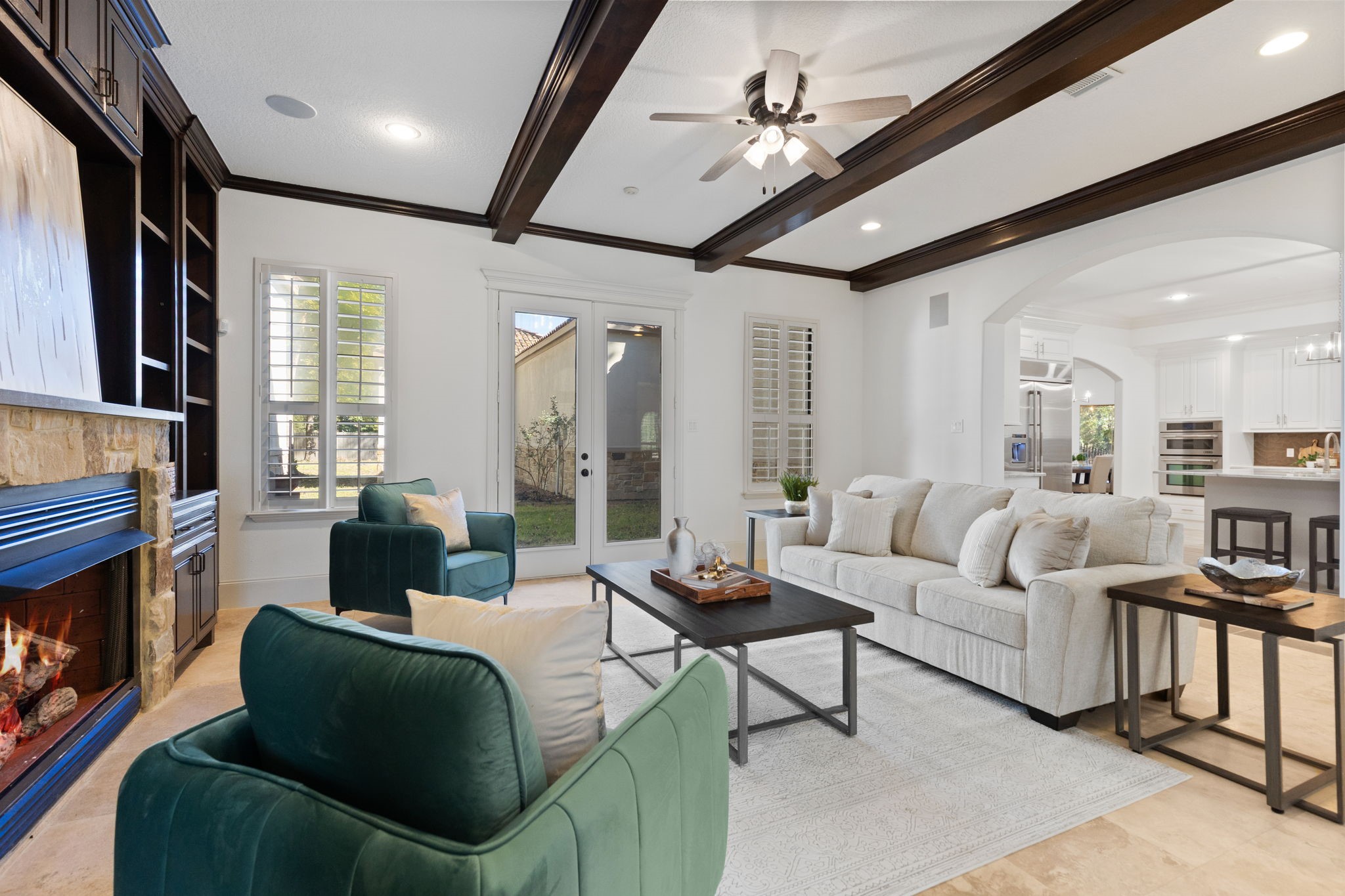 27502 Whispering Maple Way Spring, TX 77386 - Photo 10 of 46 a living room with furniture ceiling fan and a fireplace
