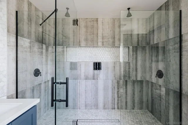 a living room with patio furniture and a fireplace