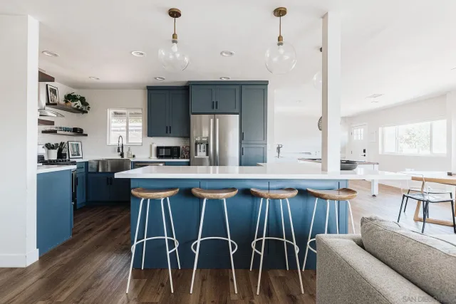 a view of table chair and wooden floor