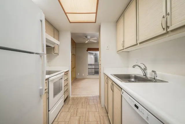 a kitchen with a stove and a refrigerator