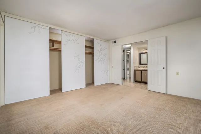 a bathroom with a granite countertop sink vanity and a mirror