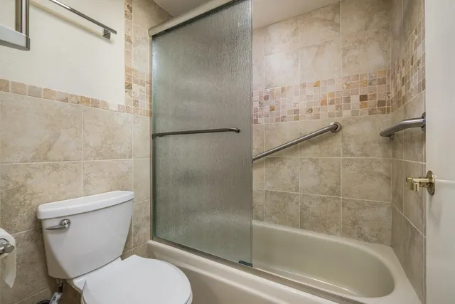 a view of a chairs and table in the patio