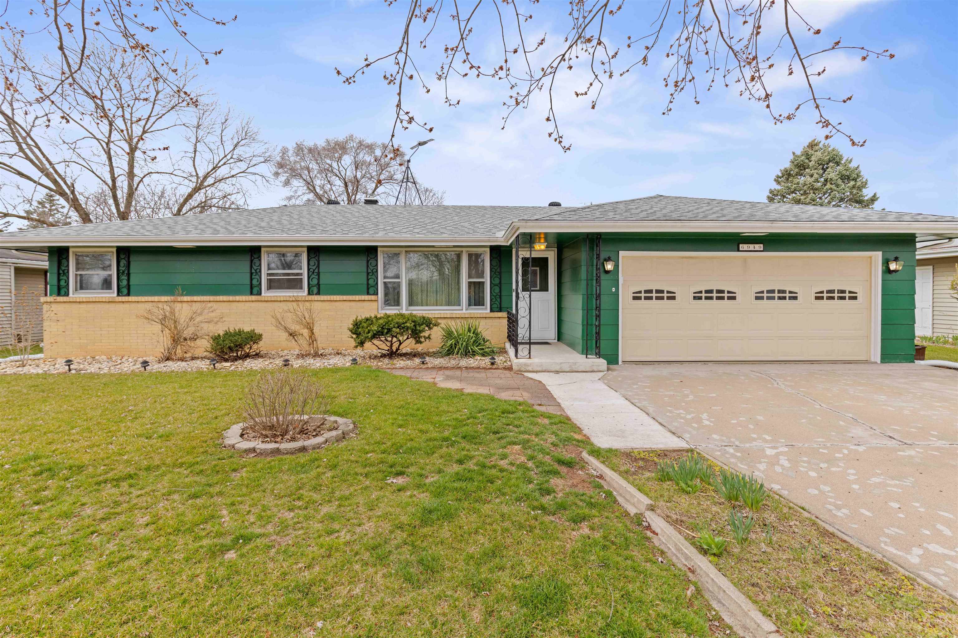 6949 Ralph Road Rockford, IL 61109 - Photo 1 of 27 a view of a house with garden