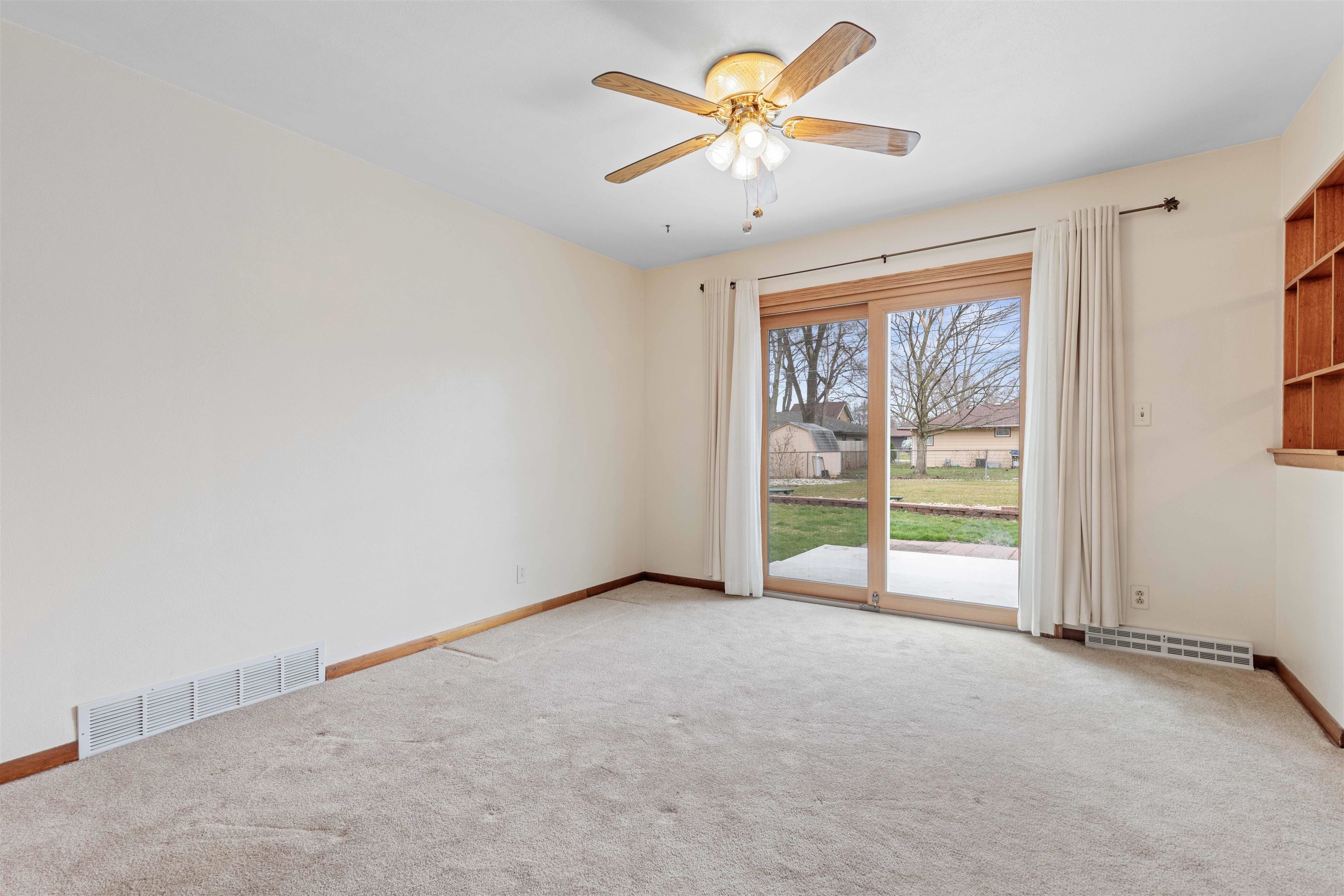 6949 Ralph Road Rockford, IL 61109 - Photo 2 of 27 an empty room with windows