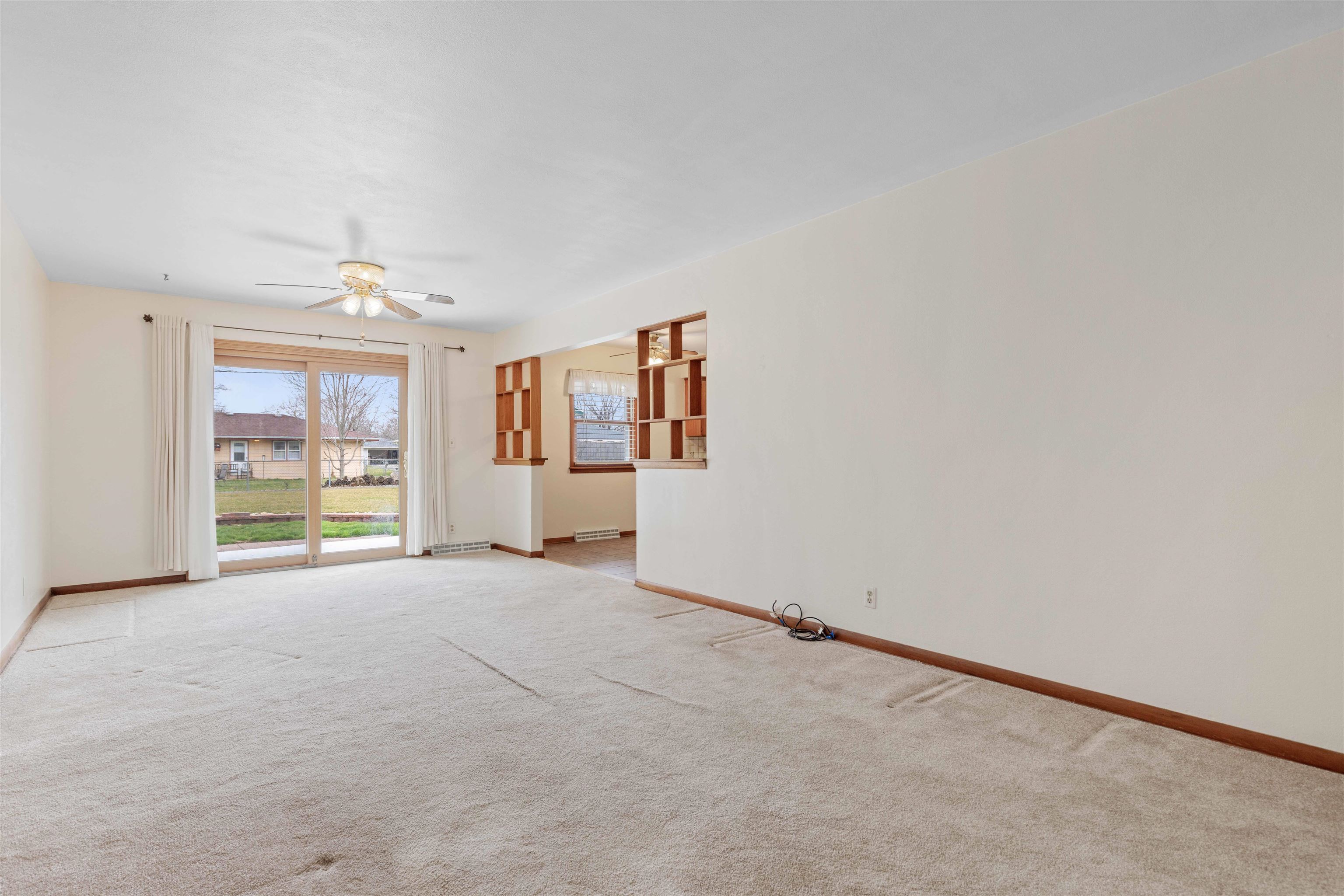 6949 Ralph Road Rockford, IL 61109 - Photo 3 of 27 an empty room with windows