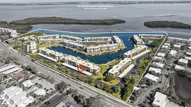 a view of swimming pool with outdoor seating and plants