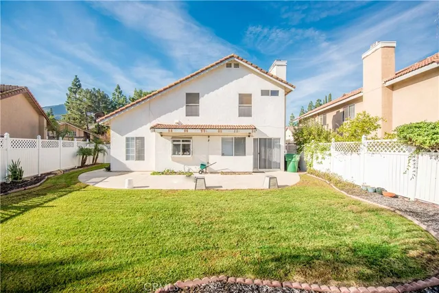 a front view of a house with swimming pool having outdoor seating