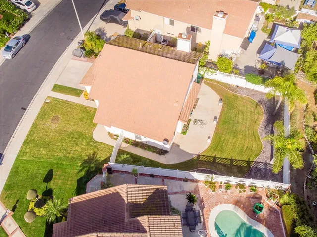 an aerial view of a house with a swimming pool